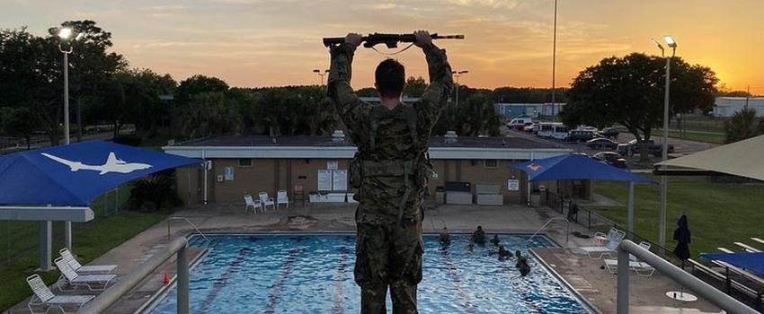 Cadet on platfor with pool in the background