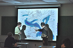 Dr. Blackwell Instructing Student in Synoptic Briefing