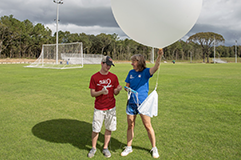 Student working with a weather balloon.