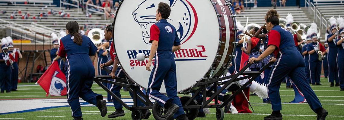 Jaguar Marching Band on the Field with Bass Drum
